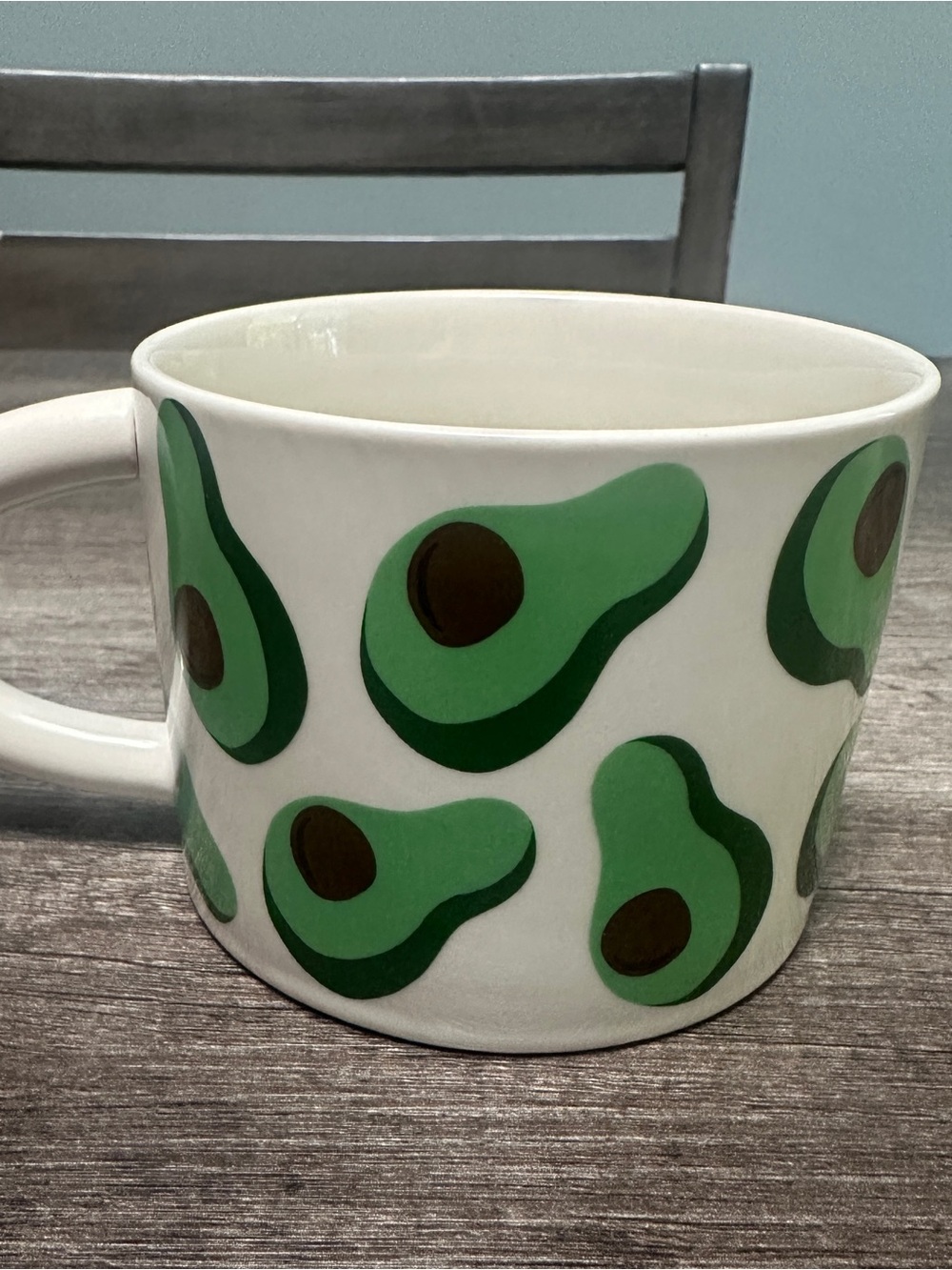 Avocado mug with green avocado slices and brown pits #avocado #kitchen